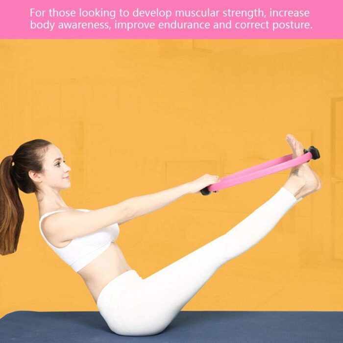 Woman doing Pilates exercise with resistance band.