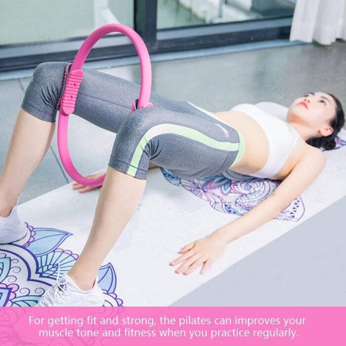 Woman doing pilates with a fitness ring.